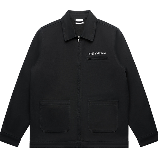 Front view of a black unisex relaxed fit jacket with a collar, front zip closure, and two lower front patch pockets. Features a white 'THE POISON' text print above a small zip chest pocket on the right side.